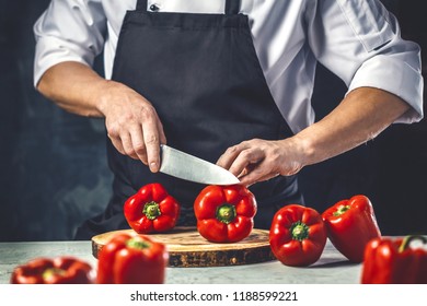 Chef cook preparing vegetables in his kitchen. - Powered by Shutterstock