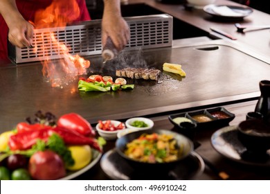 Chef Cooking Beef Teppanyaki On A Hot Plate