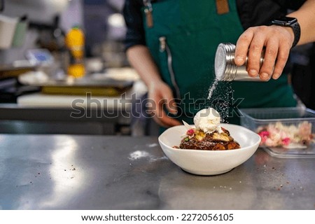 chef cooking dessert in the kitchen