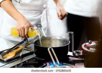 Chef Cooking, Chef Preparing Food In The Kitchen