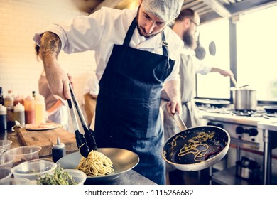 Chef Cooking Spagetti In The Kitchen