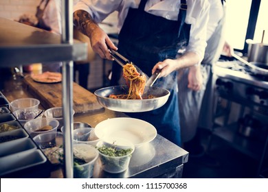 Chef Cooking Spagetti In The Kitchen