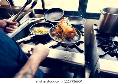 Chef Cooking Spagetti In The Kitchen