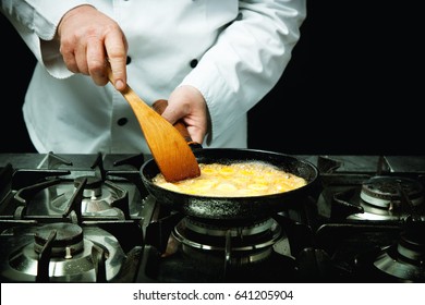 Chef Cooking And Stir Omelette