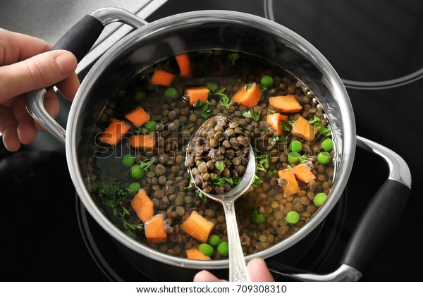 Chef Cooking Tasty Lentils On Electric Stock Photo Edit Now