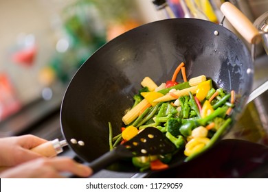 Chef Cooking Vegetables In Wok Pan