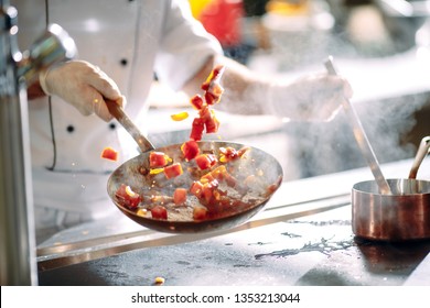 Chef Cooking Vegetables In Wok Pan. Shallow Dof