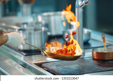 Chef Cooking Vegetables In Wok Pan. Shallow Dof