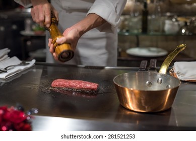 Chef Cooking Wagyu Beef In Japanese Teppanyaki Restaurant, Tokyo, Very Shallow Focus
