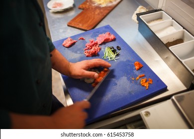 Chef cuts vegetables