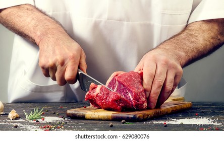 Chef Cutting Beef Meat.