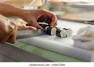 Chef Cutting Kani Sushi Rolls