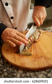 chef cutting a lobster