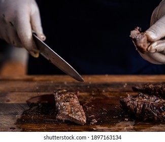 Chef Cutting Steak Revealing Pink Center