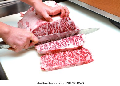 chef cutting wagyu to a perfect steak size