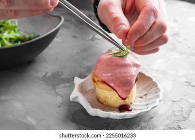 chef decorated plate with food on kitchen - Shutterstock ID 2255016233