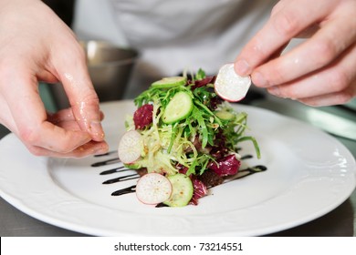 Chef is decorating appetizer - Shutterstock ID 73214551