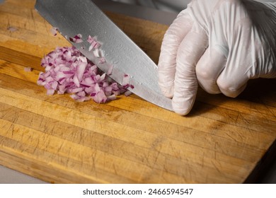 Chef dicing red onions with a cook's knife. Above shot in studio. - Powered by Shutterstock