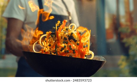 Chef Expertly Stir-fries Vibrant Vegetables in Flaming Wok, Culinary Skills and the Art of Cooking in Professional Kitchen Setting, Emphasizing Fresh Ingredients and Dynamic Cooking Techniques. - Powered by Shutterstock