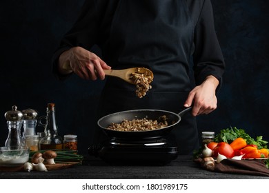 Chef Fats Meat With Mushrooms For Cooking, On The Background Of Vegetables, Freezing In Motion, Culinary Recipes, Menus, Restaurant Business, Home Recipes