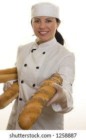 Chef Or Foodservice Worker Holding Seeded Rolls