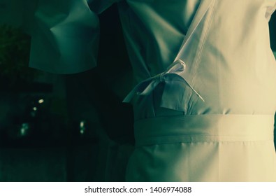 Chef gets ready for work and puts on his clothes