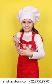 Chef Girl Kneading Dough Isolated On Yellow Background