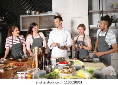 Chef And Group Of Young People During Cooking Classes