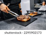 chef hand cooking big large cheese burger on restaurant kitchen. step by step