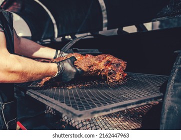Chef hand cooking grilled beef meat in BBQ smoker. - Shutterstock ID 2162447963
