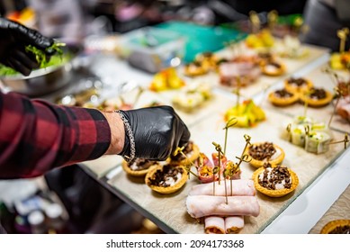 Chef hand is in process of Preparing catering food