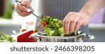 Chef Hands Cooking Dieting Lettuce Vegetable Salad. Man Mixing Tomato and Cucumber Ingredient in Saucepan with Kitchen Spoon. Dieting Home Culinary. Fresh Delicious Dish Horizontal Photography