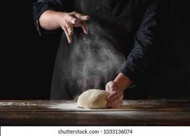 Chef Hands Cooking Dough On Dark Wooden Background. Food Concept.