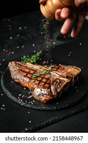 Chef hands cooking meat steak and adding seasoning in a freeze motion. Fresh raw Prime Black Angus beef rump steak. banner, menu recipe. - Shutterstock ID 2158448967