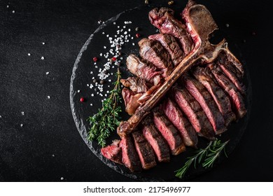 Chef hands cooking meat steak and adding seasoning in a freeze motion. Fresh raw Prime Black Angus beef rump steak. banner, menu recipe. - Shutterstock ID 2175496977