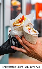 Chef Hands Gives A Gyros To Man From Food Truck On Street. Street Food, Fast Food.