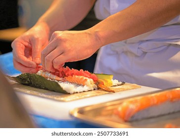 chef hands preparing japanese food, chef making sushi, Preparing Maki Sushi roll