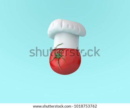Chef hat with tomato concept on pastel blue background. minimal idea food and fruit concept. An idea creative to produce work within an advertising marketing communications or artwork design.