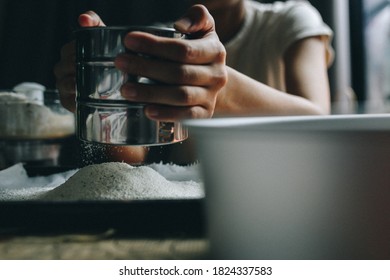 The chef is intending to sift the flour. Prepare raw materials To make various desserts To the customer in the morning - Shutterstock ID 1824337583