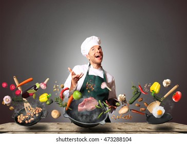 Chef juggling with vegetables and other food in the kitchen - Powered by Shutterstock