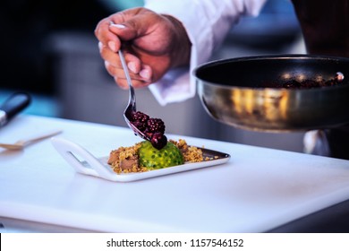 The Chef In The Kitchen Prepares Fruit Dessert. Close Up