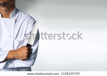 Chef with a knive background with space for text