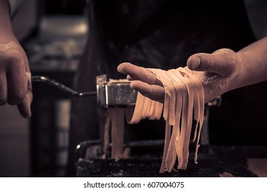 The chef makes fresh spaghetti from scratch.