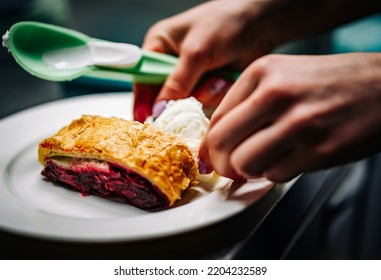 Chef Making Cherry Strudel With Ice Cream