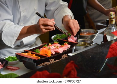 Chef making kobe sushi on boat, japanese wagyu beef sushi
