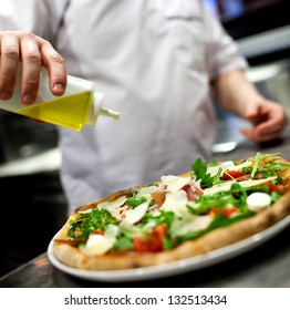 Chef Making Pizza At Kitchen