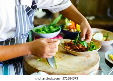 Chef making traditional cambodian meat dish at cooking class - Shutterstock ID 571884073