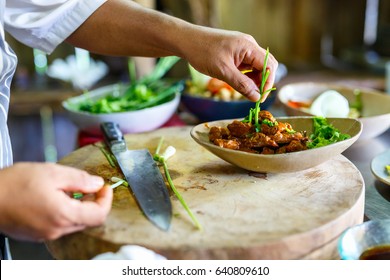 Chef making traditional cambodian meat dish at cooking class - Powered by Shutterstock