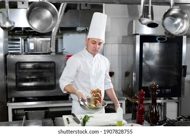 Chef marinates the shrimp before frying - Powered by Shutterstock