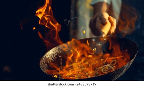 Chef Masterfully Stir-fries Vibrant Vegetables in Flaming Wok, Capturing the Essence of Dynamic Cooking and Fresh Ingredients in Professional Kitchen Setting, Highlighting Culinary Expertise - Powered by Shutterstock